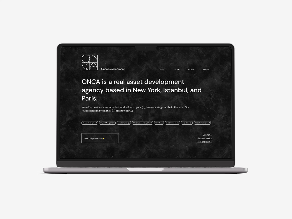 ONCA Development website on a laptop display.